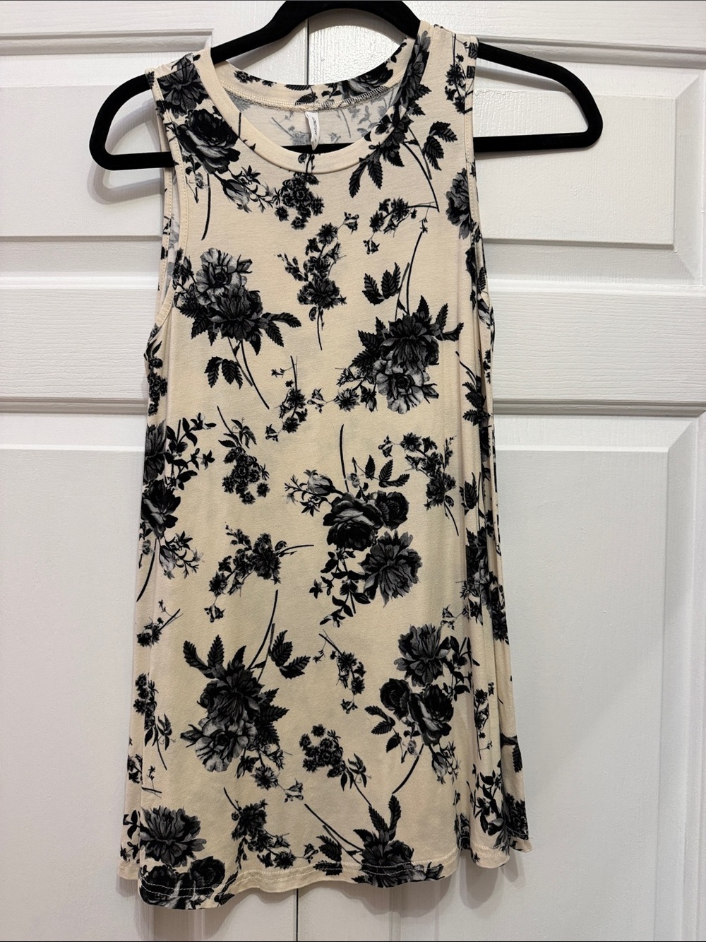 Sleeveless Black Floral Tank Top on Cream Background - Women